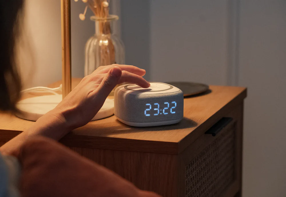 Serene bedroom setup with sunrise alarm creating perfect morning ambiance